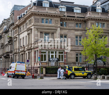 SAMU mobile emergency medical service car and paramedic ambulance in front of hotel Strasbourg Alsace France Stock Photo