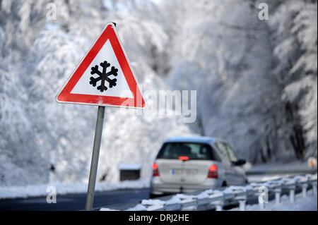 Hoher Meissner, Germany, Germany. 27th Jan, 2014. A sign warns of snow on the streets on the Hoher Meissner mountain in Hoher Meissner, Germany, Germany, 27 January 2014. Photo: Uwe Zucchi/dpa/Alamy Live News Stock Photo