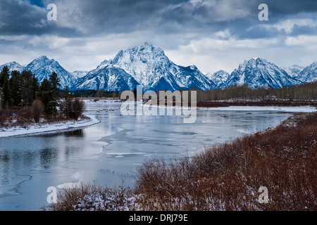 Mount Moran Grand Tetons from Oxbow Bend Wyoming geese flying over water Stock Photo