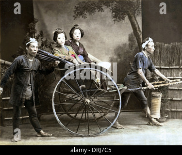 Two women in rickshaw, Japan Stock Photo