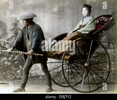 Geisha in rickshaw, Japan Stock Photo