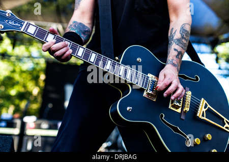 Tim Armstrong of Rancid performs on his guitar at the Hootenanny festival in Silverado Canyon, California, on 8 July 2012. Stock Photo