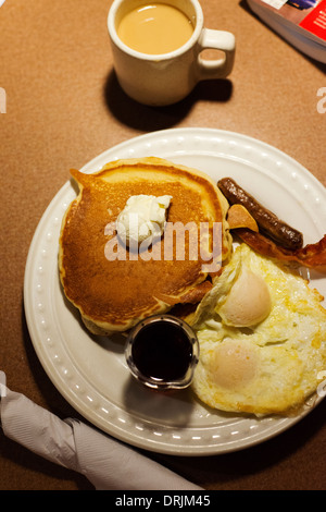 Typical American fast food breakfast of pancakes and eggs from a chain restaurant. Stock Photo