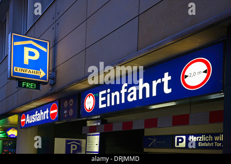 Signs for the entrance in a multi-storey car park in the evening on the Potsdam place, Berlin, middle, Germany, Europe, public r Stock Photo