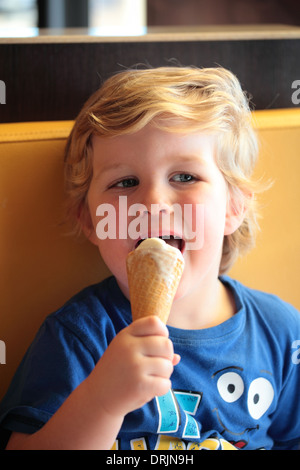 Young boy eating ice cream cone Stock Photo