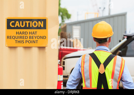 Electrical engineer wearing hard hat in a power plant facility Stock Photo