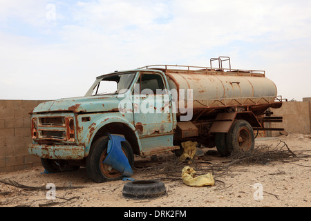 Abandoned water truck in the middle of the dunes south of Abu Dhabi