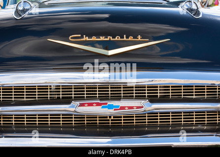 Grill detail and badge on bonnet of old Chevrolet car Stock Photo