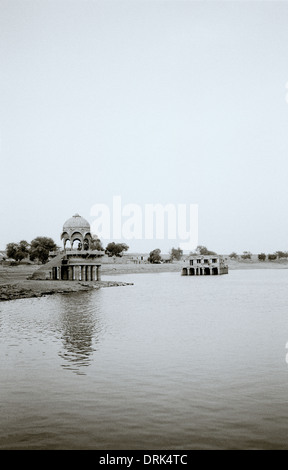 Gadisar Lake in Jaisalmer in Rajasthan in India in South Asia. Serenity Landscape Tranquillity Peace Sky Beauty Travel Escapism Wanderlust Stock Photo