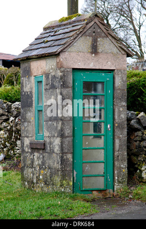 A unique, British phone box built from local limestone to blend with surroundings in Chelmorton, Peak District, Derbyshire,UK Stock Photo