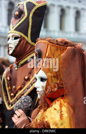 Carnival in Venice: Elegant Couple in Masks and Costumes Stock Photo ...