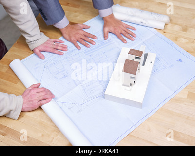 business people reviewing blueprint Stock Photo