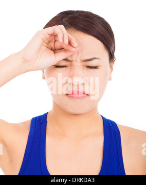 disappointed pretty girl with touching head over white background Stock Photo