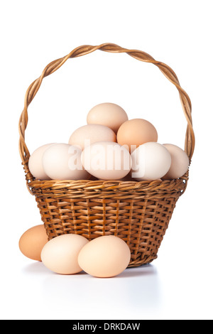 Chicken eggs in basket on white background Stock Photo