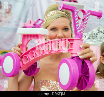 Nuremberg, Germany. 28th Jan, 2014. Maja Synke Princess of Hohenzollern presents her new toy collection with little Anna-Katharina during the news show at the 65th International Toy Fair in Nuremberg, Germany, 28 January 2014. Photo: Daniel Karmann/dpa/Alamy Live News Stock Photo