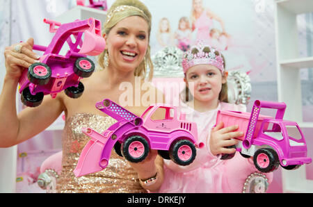 Nuremberg, Germany. 28th Jan, 2014. Maja Synke Princess of Hohenzollern presents her new toy collection with little Anna-Katharina during the news show at the 65th International Toy Fair in Nuremberg, Germany, 28 January 2014. Photo: Daniel Karmann/dpa/Alamy Live News Stock Photo