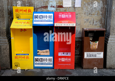 London, England, UK. Free Chinese language newspapers in Chinatown Stock Photo