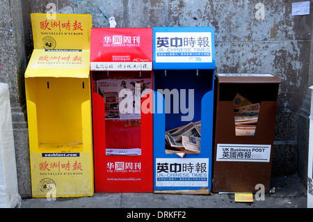 London, England, UK. Free Chinese language newspapers in Chinatown Stock Photo