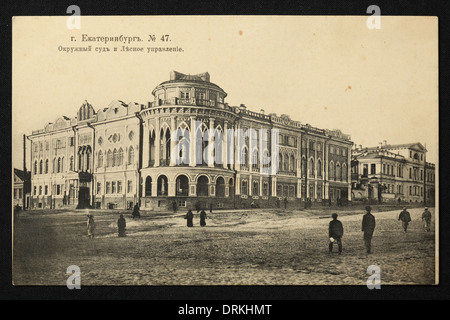 District Court also known as Sevastianov House in Yekaterinburg, Russian Empire. Black and white vintage photograph by an unknown photographer dated from the beginning of the 20th century issued in the Russian vintage postcard published by A.S. Suvorin, Yekaterinburg. Text in Russian: Yekaterinburg. The District Court and the Forest Administration. The District Court also known as Sevastianov House or the Trade Union House is the architectural monument from the 19th century now served as one of the official residences of Russian president. Courtesy of the Azoor Postcard Collection. Stock Photo