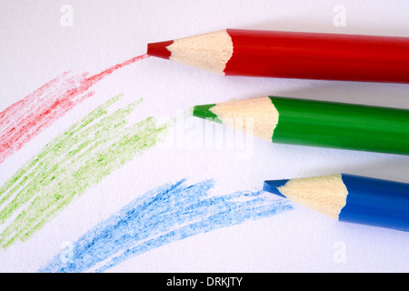 Red blue and green coloured pencils ans scribbles Stock Photo