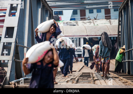 Unloading rice at the port, Yangon, Myanmar Stock Photo