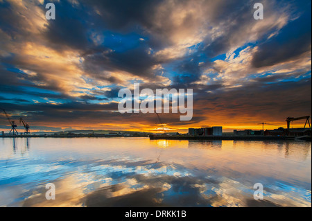 Belfast harbor during sunrise. Stock Photo