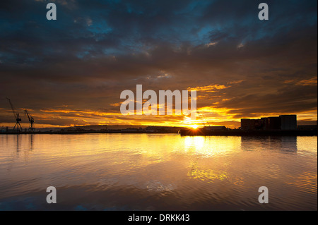 Belfast harbor during sunrise. Stock Photo