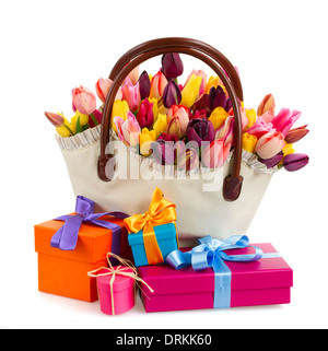 Bag  of tulips flowers  with gift boxes Stock Photo