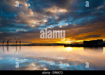 Belfast harbor during sunrise. Stock Photo