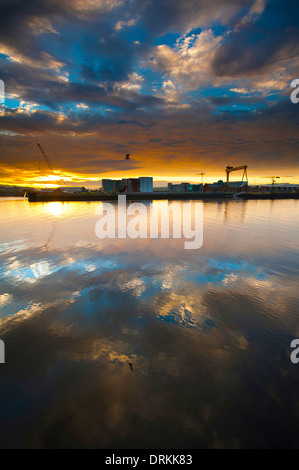 Belfast harbor during sunrise. Stock Photo