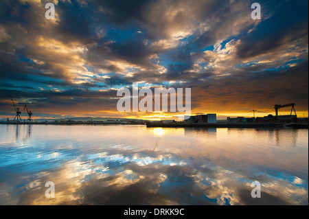 Belfast harbor during sunrise. Stock Photo