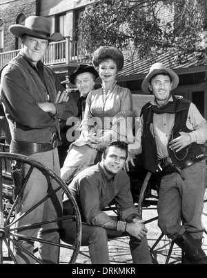 GUNSMOKE  CBS Productions TV series. From left: James Arness, Milburn Stone, Amanda Blake, Burt Reynolds, Ken Curtis Stock Photo