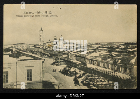 The town of Irbit in the Ural Mountains, Russian Empire. Black and white vintage photograph by an unknown photographer dated from the beginning of the 20th century issued in the Russian vintage postcard published by N.D. Larkov. Text in Russian: Irbit. The north-eastern part of the town. Cathedral. Irbit is a town in Sverdlovsk region, Russia, located some 203 km from Yekaterinburg. The town was famous in the 19th century for the Irbit Fair, which was the second largest in Russia. Courtesy of the Azoor Postcard Collection. Stock Photo