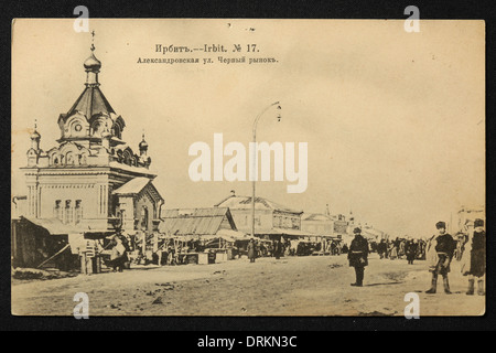 Black Market in the town of Irbit in the Ural Mountains, Russian Empire. Black and white vintage photograph by an unknown photographer dated from the beginning of the 20th century issued in the Russian vintage postcard published by N.D. Larkov. Text in Russian: Irbit. Alexandrovskaya Street. Black Market. Irbit is a town in Sverdlovsk region, Russia, located some 203 km from Yekaterinburg. The town was famous in the 19th century for the Irbit Fair, which was the second largest in Russia. Courtesy of the Azoor Postcard Collection. Stock Photo