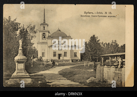 Holy Trinity Church at the cemetery in the town of Irbit in the Ural Mountains, Russian Empire. Black and white vintage photograph by an unknown photographer dated from the beginning of the 20th century issued in the Russian vintage postcard published by N.D. Larkov. Text in Russian: Irbit. Cemetery. Holy Trinity Church. Irbit is a town in Sverdlovsk region, Russia, located some 203 km from Yekaterinburg. The town was famous in the 19th century for the Irbit Fair, which was the second largest in Russia. Courtesy of the Azoor Postcard Collection. Stock Photo