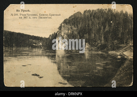 Rock formations on the Chusovaya River in the Ural Mountains, Russian Empire. Black and white vintage photograph by Russian photographer Veniamin Metenkov dated from the beginning of the 20th century issued in the Russian vintage postcard published by Veniamin Metenkov himself in Yekaterinburg, Russia. Text in Russian: In the Urals. Chusovaya River. Krasny Rock (Beautiful Rock) located 367 verst (391 km) from Bilimbai. Courtesy of the Azoor Postcard Collection. Stock Photo