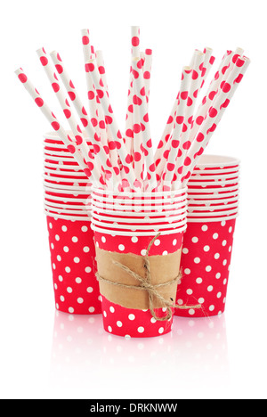 Red paper cups and polka dot straws for birthday party isolated on white Stock Photo