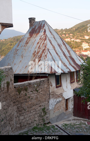 House with rusted corrugated iron roof, Jajce, Bosnia and Herzegovina Stock Photo
