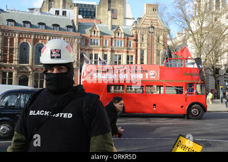 London UK, 28th January 2014 : '3 Cosas' Party Bus fellow by Bike the strike! Join '3 Cosas' campaign for sick pay, holidays and pensions on the second days strike around Parliament. Demand equity sick pay, holidays and pensions as the local in London. Credit:  See Li/Alamy Live News Stock Photo