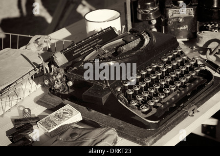 Old typewriter on a world war 2 style desk display Stock Photo