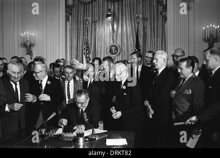 US President Lyndon B. Johnson signs the 1964 Civil Rights Act as ...