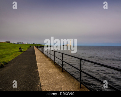 Promenade leading to the causeway, to St Mary's Island and lighthouse. Whitley Bay, Tyne and Wear. Stock Photo