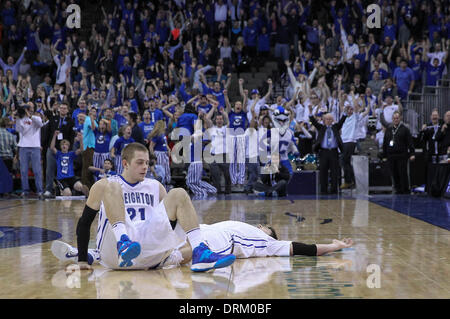 Omaha, Nebraska, USA. 28th Jan, 2014. Jan 28, 2014 - Omaha, NE U.S. - Creighton Bluejays fans react to Creighton Bluejays forward Doug McDermott #3 game winning 3 point shot with less than 4 seconds on the clock during an NCAA men's basketball game between St. John's Red Storm and Creighton Bluejays at Century Link Center in Omaha, NE.Creighton Bluejays forward Doug McDermott #3 lays back after falling to the floor when his 3 point shot went through the net. Teammate Creighton Bluejays guard Isaiah Zierden #21 was knocked to the floor during the shot attempt.Doug McDer © csm/Alamy Live News Stock Photo