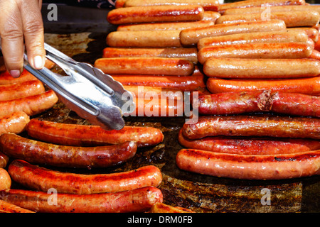 Miami Beach Florida,Ocean Drive,Art Deco Weekend,festival,street fair,food,vendor vendors stall stalls booth market marketplace,hot dogs,sausages,cook Stock Photo