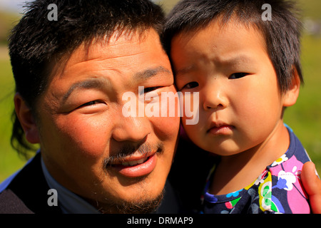 Mongolian man posing with his daughter Stock Photo