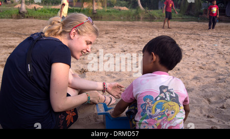 Female Aid Worker with child Phnom Penh Cambodia South East Asia Stock ...