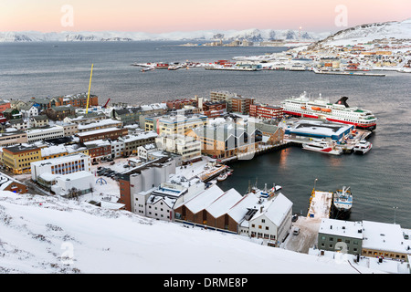 Hammerfest, Norway, the northernmost town in the world, with cruise ship Nordnorge in port and natural gas plant in the distance Stock Photo