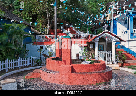 Old well and shrine Fontainhas quarter Panjim Tiswadi Goa India Stock Photo