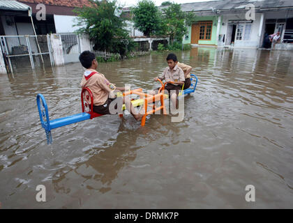 South Jakarta, Jakarta, Indonesia. 29th Jan, 2014. Children's playing in the park on flood water using rafts. The capital's disaster management agency say, the number of refugees in Jakarta has shown a steep rise from 30,784 people recorded on 19 January, to 89,334 people on 22 January 2014. Authorities have warned of a possible worsening of the weather as the rainy season is set to last until February. Credit:  Afriadi Hikmal/ZUMA Wire/ZUMAPRESS.com/Alamy Live News Stock Photo