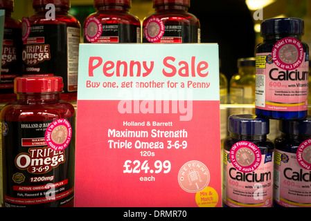 Penny Sale sign in health shop window in January sales in UK viewed from the street Stock Photo
